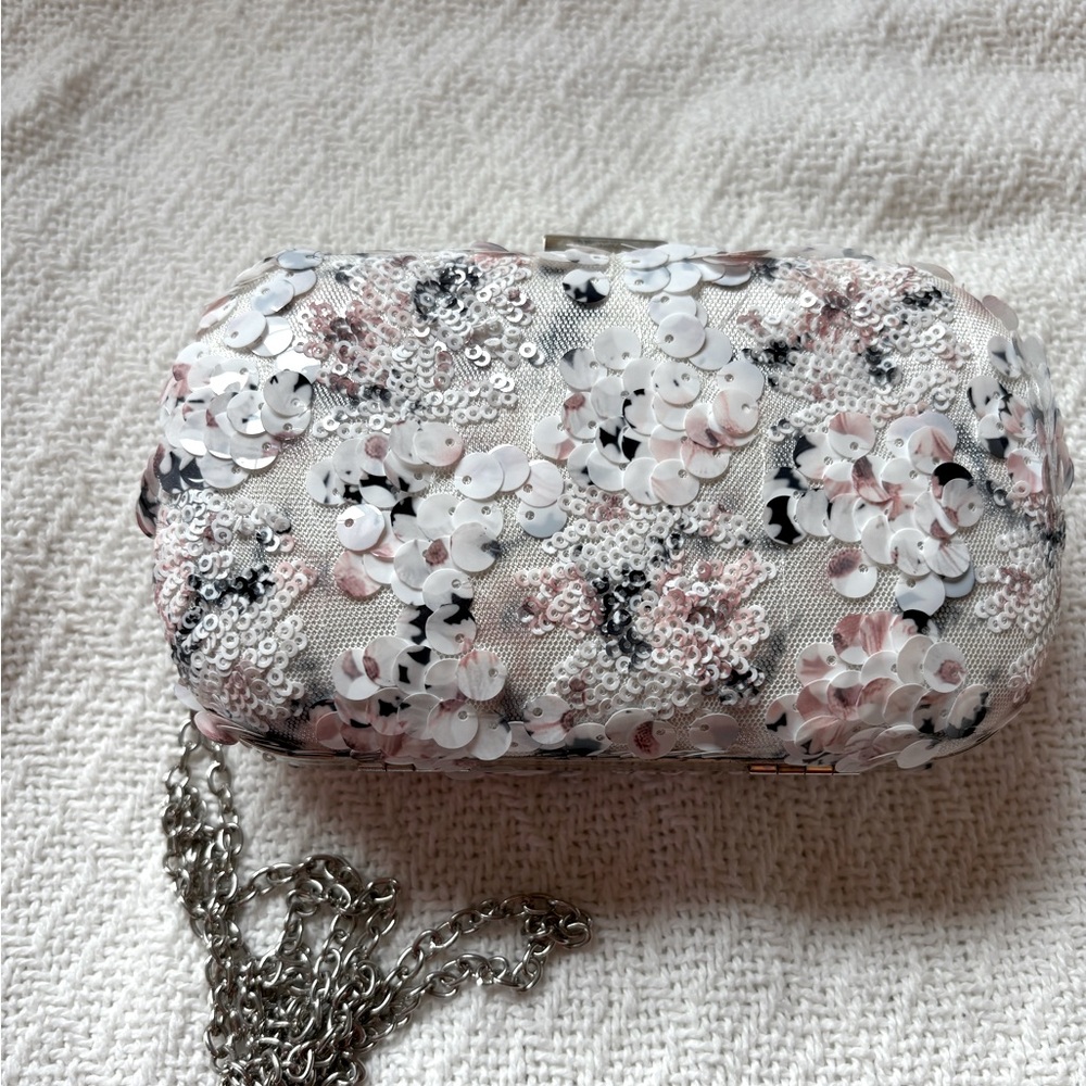 Elegant clutch white, black and blush pink evening bag with silver chain.